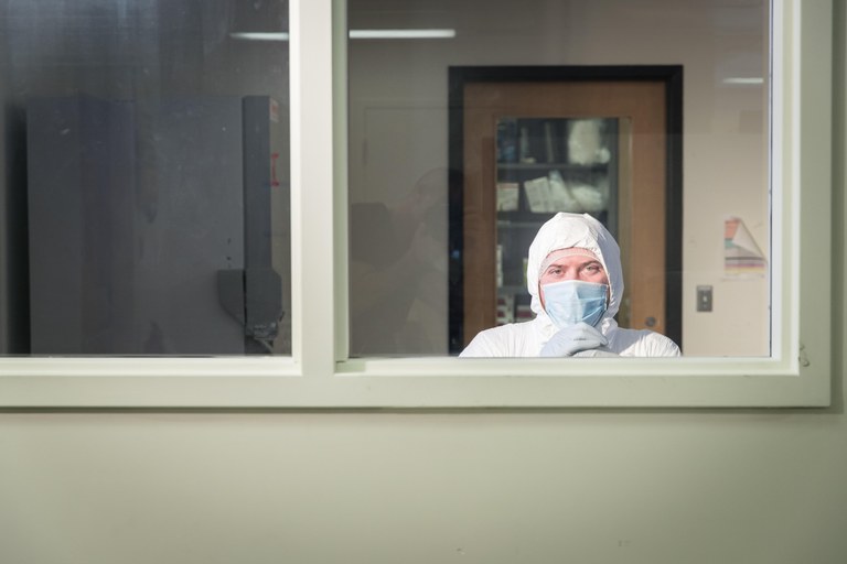 Graduate student Emil Karpinski in the Sample Prep Room of the McMaster Ancient DNA Centre Clean Labs. Credit: JD Howell, McMaster University