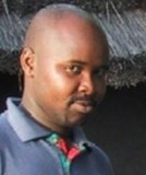 John B A Okello